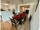 Dining area with six-chair table and view into living room at 122 Gulf Breeze Blvd, Venice, FL 34293