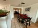 Dining room with a dark wood table and six chairs at 122 Gulf Breeze Blvd, Venice, FL 34293