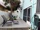 Backyard deck area with outdoor seating and greenery, perfect for relaxation at 130 Bay Plz, Treasure Island, FL 33706