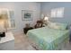 Bedroom with light blue walls, a comfy bed and window shutters at 130 Bay Plz, Treasure Island, FL 33706