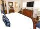 Bedroom with a light interior, wood floors, and television at 130 Bay Plz, Treasure Island, FL 33706