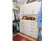 Walk-in closet featuring ample shelving, drawers, and hanging storage at 130 Bay Plz, Treasure Island, FL 33706