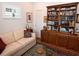 Bright office with comfortable sofa and built-in bookcase at 130 Bay Plz, Treasure Island, FL 33706