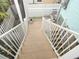 Stairs leading down to a patio area at 130 Bay Plz, Treasure Island, FL 33706