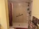 Bathroom with walk-in shower and grab bar at 1415 Doolittle Ln # 107, Dunedin, FL 34698