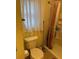 Bright bathroom with toilet and shower stall at 1415 Doolittle Ln # 107, Dunedin, FL 34698