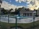 Community pool with patio and cabana at 1415 Doolittle Ln # 107, Dunedin, FL 34698