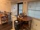 Small dining area with round table and chairs at 1415 Doolittle Ln # 107, Dunedin, FL 34698