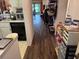 Kitchen with dark flooring and pass through at 1415 Doolittle Ln # 107, Dunedin, FL 34698