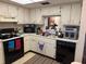 Kitchen with ample counter space and appliances at 1415 Doolittle Ln # 107, Dunedin, FL 34698