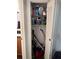 Bathroom storage closet with shelving at 1415 Doolittle Ln # 107, Dunedin, FL 34698