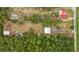 Aerial view of property showing home, outbuildings, and expansive land at 3011 39Th E St, Bradenton, FL 34208