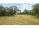 Large grassy backyard with detached workshop and playset at 3011 39Th E St, Bradenton, FL 34208