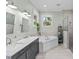 Elegant bathroom with double vanity, soaking tub, and separate shower at 3011 39Th E St, Bradenton, FL 34208