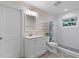 Clean bathroom with white vanity, shower, and tile floors at 3011 39Th E St, Bradenton, FL 34208