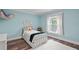 Cozy bedroom with a single bed and light blue walls at 3011 39Th E St, Bradenton, FL 34208