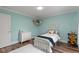 Charming bedroom with a twin bed, dresser, and wood floors at 3011 39Th E St, Bradenton, FL 34208