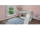 Bedroom with bunk bed, slide, and patterned rug at 3011 39Th E St, Bradenton, FL 34208