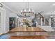 Bright dining room with a rustic wooden table and chandelier at 3011 39Th E St, Bradenton, FL 34208