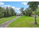 Two-story home with long driveway and lush green lawn at 3011 39Th E St, Bradenton, FL 34208