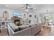 Living room with sectional sofa, shiplap walls, and fireplace at 3011 39Th E St, Bradenton, FL 34208