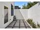 Private courtyard with flagstone patio, gravel, and modern zen garden at 3110 W Napoleon Ave, Tampa, FL 33611