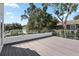 Spacious rooftop deck with composite wood and glass railing at 3110 W Napoleon Ave, Tampa, FL 33611