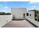 Modern rooftop deck with gray composite flooring and city view at 3110 W Napoleon Ave, Tampa, FL 33611