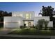 Stunning modern home exterior at twilight, showcasing clean lines and curb appeal at 3110 W Napoleon Ave, Tampa, FL 33611