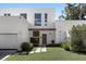 Modern two-story home with white exterior and landscaped lawn at 3110 W Napoleon Ave, Tampa, FL 33611