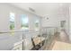 Modern hallway with glass railing and hardwood floors at 3110 W Napoleon Ave, Tampa, FL 33611