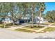 Two-story house nestled in a neighborhood setting with mature trees at 4101 Dellbrook Dr, Tampa, FL 33624