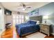 Spacious bedroom with a king-size bed and hardwood floors at 4101 Dellbrook Dr, Tampa, FL 33624