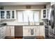 Modern kitchen with white cabinets and granite countertops at 4101 Dellbrook Dr, Tampa, FL 33624