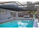 Refreshing pool with covered patio and seating at 4101 Dellbrook Dr, Tampa, FL 33624