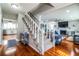 White staircase with wooden railings leading to the upper level at 4101 Dellbrook Dr, Tampa, FL 33624