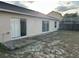 House exterior showcasing sliding glass doors opening to a backyard patio at 4710 Bloom Dr, Plant City, FL 33566