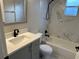 Clean bathroom, gray vanity, marble shower and bathtub at 4710 Bloom Dr, Plant City, FL 33566