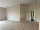 Living room with tile flooring and access to hallway at 4710 Bloom Dr, Plant City, FL 33566