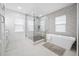 Spa-like bathroom with a freestanding tub and a large glass shower at 7899 Causeway N Blvd, St Petersburg, FL 33707