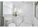 Stylish bathroom with white vanity, toilet and a frameless glass shower at 7899 Causeway N Blvd, St Petersburg, FL 33707