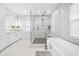 Bathroom features a walk-in shower, freestanding tub, and stylish tile at 7899 Causeway N Blvd, St Petersburg, FL 33707