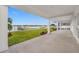 Covered patio with waterfront views and access to the backyard at 7899 Causeway N Blvd, St Petersburg, FL 33707