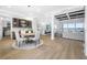 Bright dining room with modern table and chairs, hardwood floors, and access to the kitchen at 7899 Causeway N Blvd, St Petersburg, FL 33707