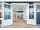 Bright and airy entryway with double doors opening to the interior living space at 7899 Causeway N Blvd, St Petersburg, FL 33707