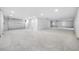 Large unfinished garage with high ceilings and an automatic door at 7899 Causeway N Blvd, St Petersburg, FL 33707