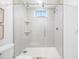 Modern shower with patterned tile and glass enclosure at 7899 Causeway N Blvd, St Petersburg, FL 33707