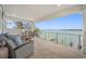 Relaxing waterfront patio with outdoor furniture, offering breathtaking water views at 7899 Causeway N Blvd, St Petersburg, FL 33707