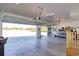 Spacious garage with overhead storage and work bench at 14818 Grady Sweat Ln, Wimauma, FL 33598