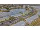 Wide aerial showcasing community by the lake at 190 Pompano Se Dr # A, St Petersburg, FL 33705